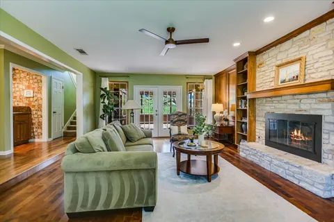 a living room with furniture and a fireplace
