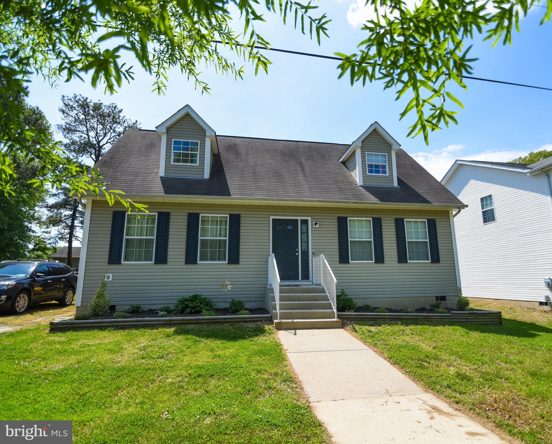 4777 St Leonard Road St. Leonard, MD 20685 - Photo 1 of 31 a front view of a house with garden