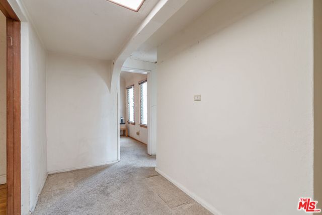 a view of bedroom with a window