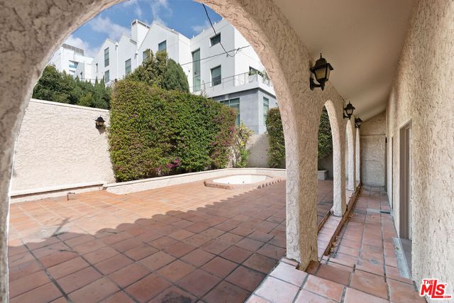 a view of a white house with a outdoor space
