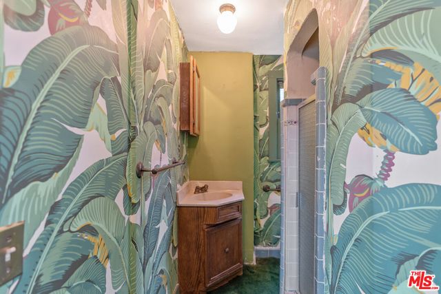 a bathroom with a sink and mirror