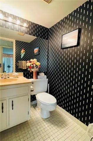 a bathroom with a toilet and a sink