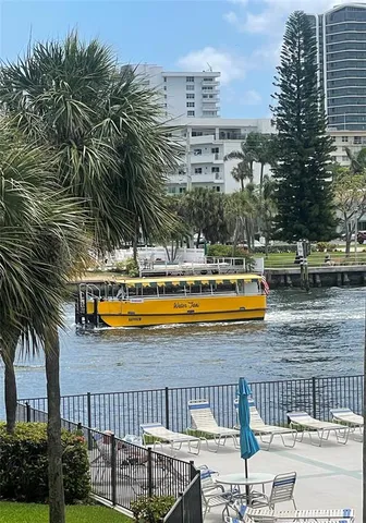 a view of swimming pool with outdoor seating and yard