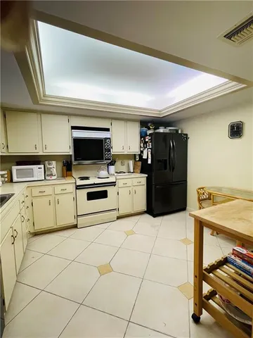 a kitchen with cabinets and appliances