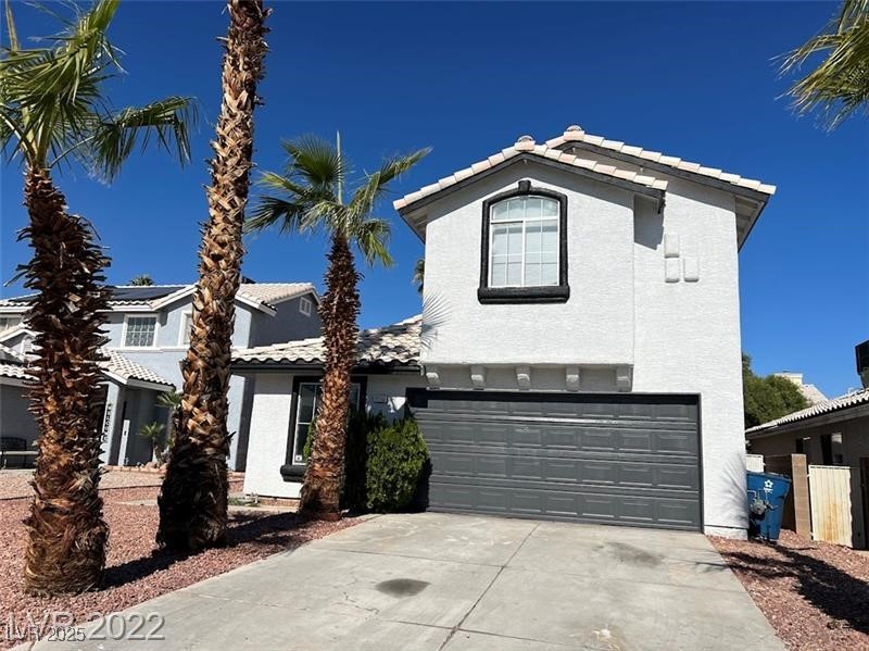 6532 Moon Roses Court Las Vegas, NV 89108 - Photo 1 of 8 View of front of property featuring stucco siding, a tile roof, a garage, and driveway