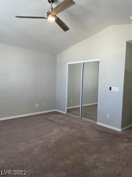 6532 Moon Roses Court Las Vegas, NV 89108 - Photo 5 of 8 Unfurnished bedroom with a closet, carpet flooring, baseboards, and vaulted ceiling