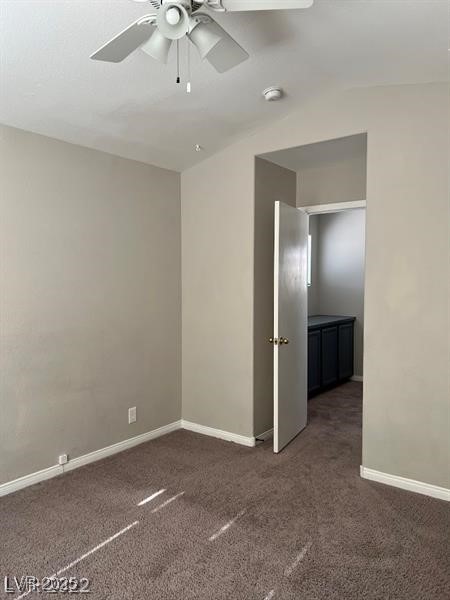 6532 Moon Roses Court Las Vegas, NV 89108 - Photo 8 of 8 Unfurnished room featuring a ceiling fan, baseboards, and dark carpet