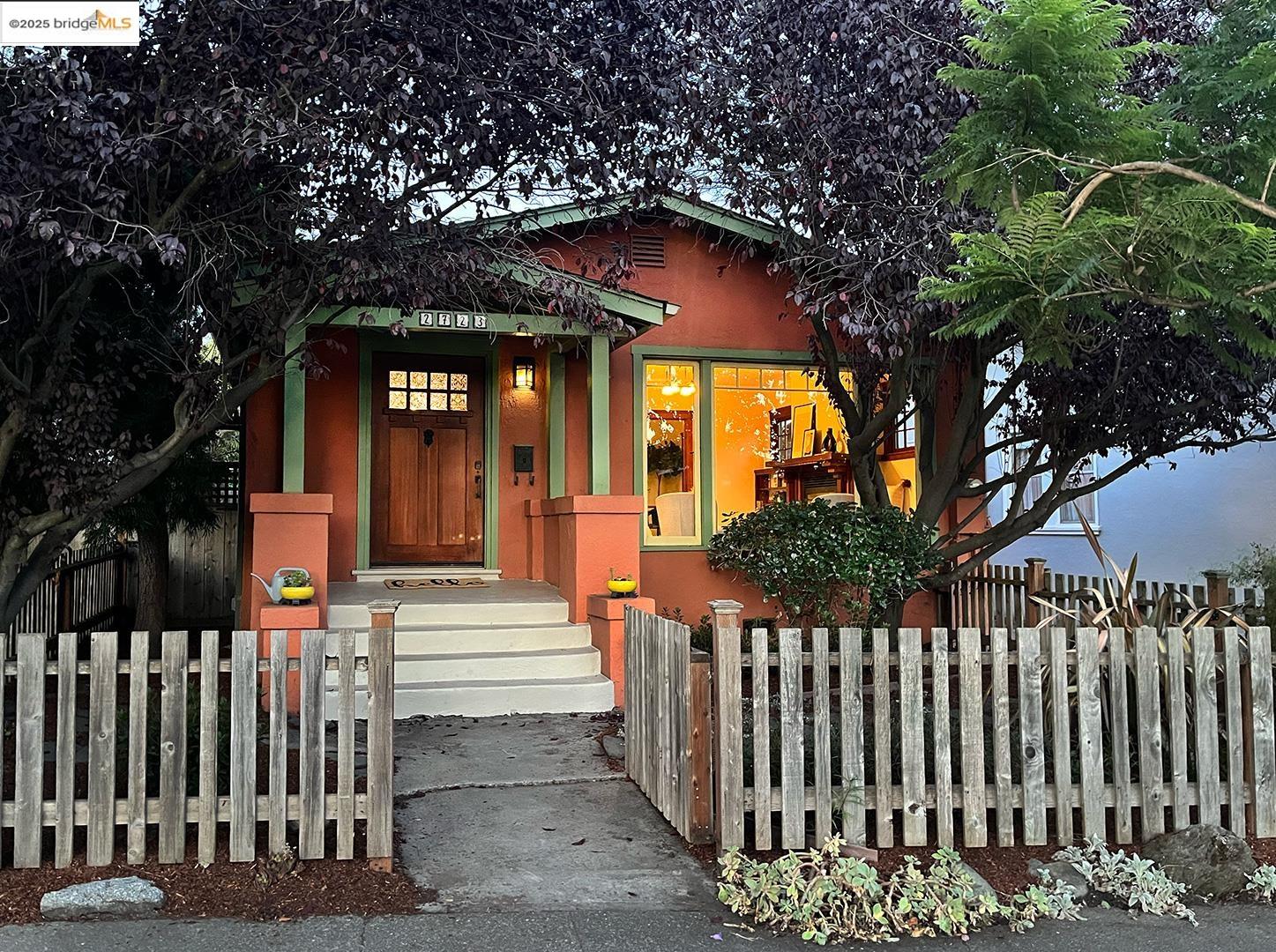a front view of a house with a small yard