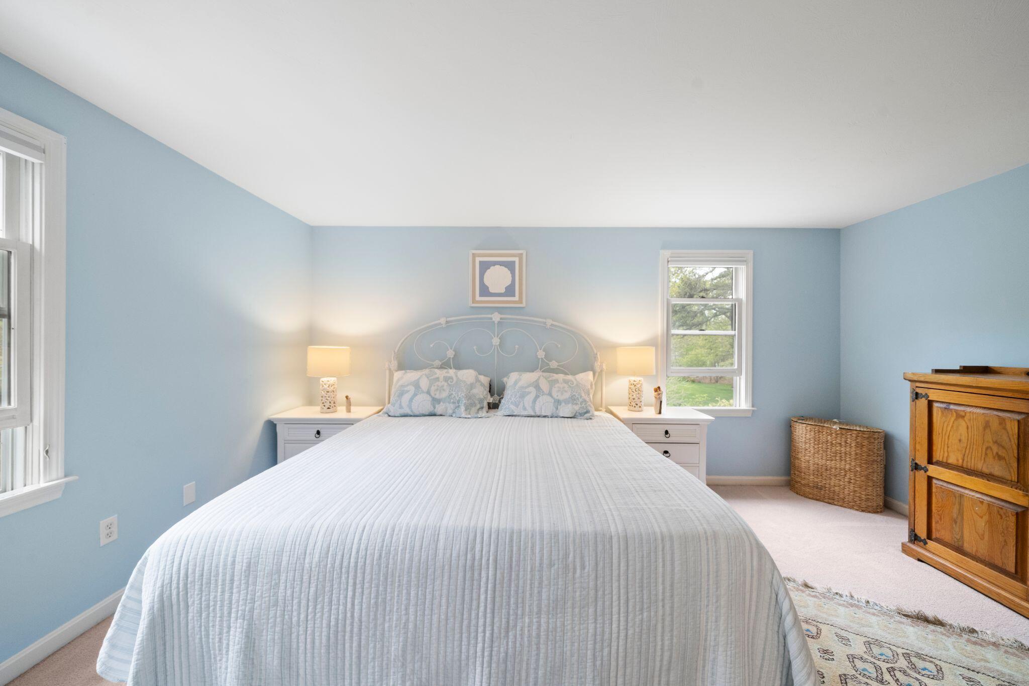 40 Sam Ryder Road Chatham, MA 02633 - Photo 24 of 42 a bedroom with a bed and wooden floor