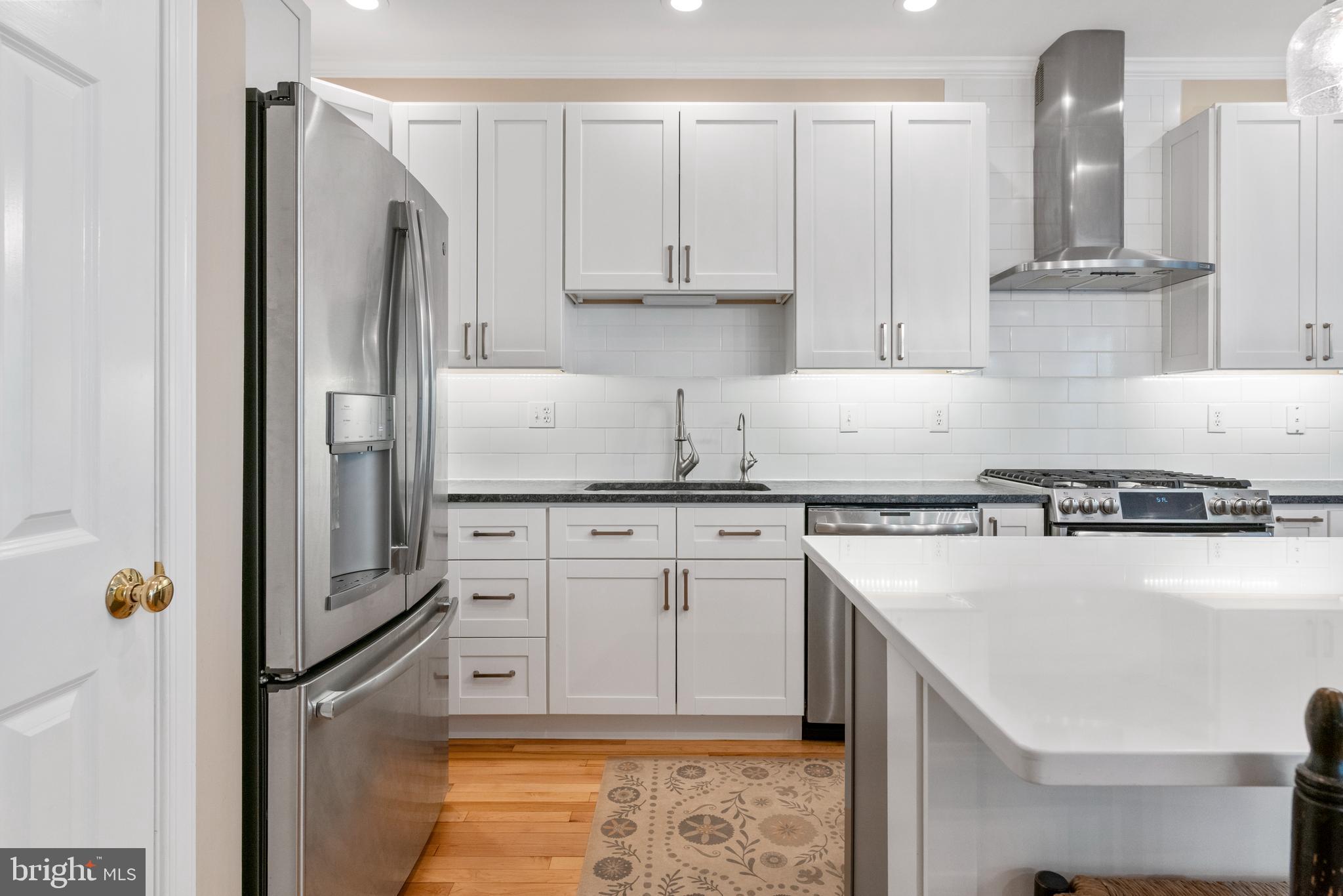 285 Cherry Lane Kennett Square, PA 19348 - Photo 16 of 38 a kitchen with stainless steel appliances granite countertop a refrigerator a stove and a sink