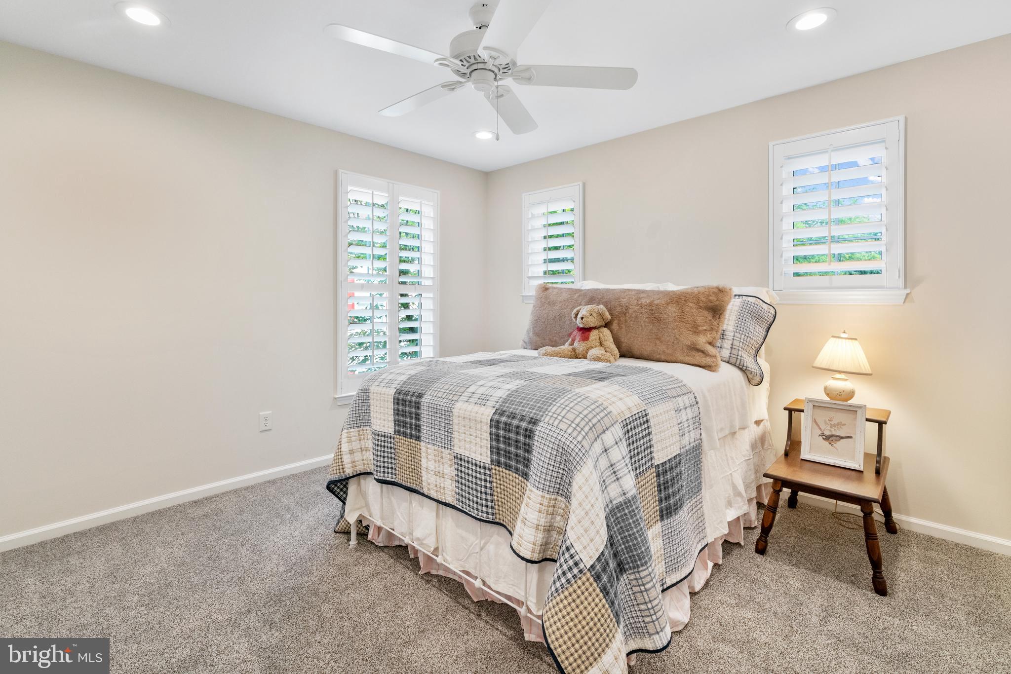 285 Cherry Lane Kennett Square, PA 19348 - Photo 22 of 38 a spacious bedroom with a bed and a table in it