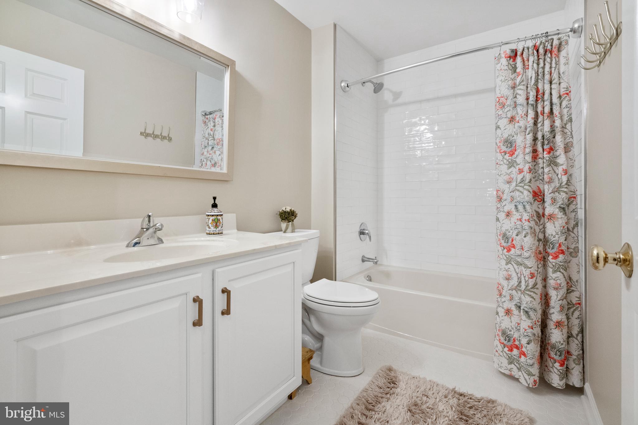 285 Cherry Lane Kennett Square, PA 19348 - Photo 25 of 38 a bathroom with a sink toilet and shower