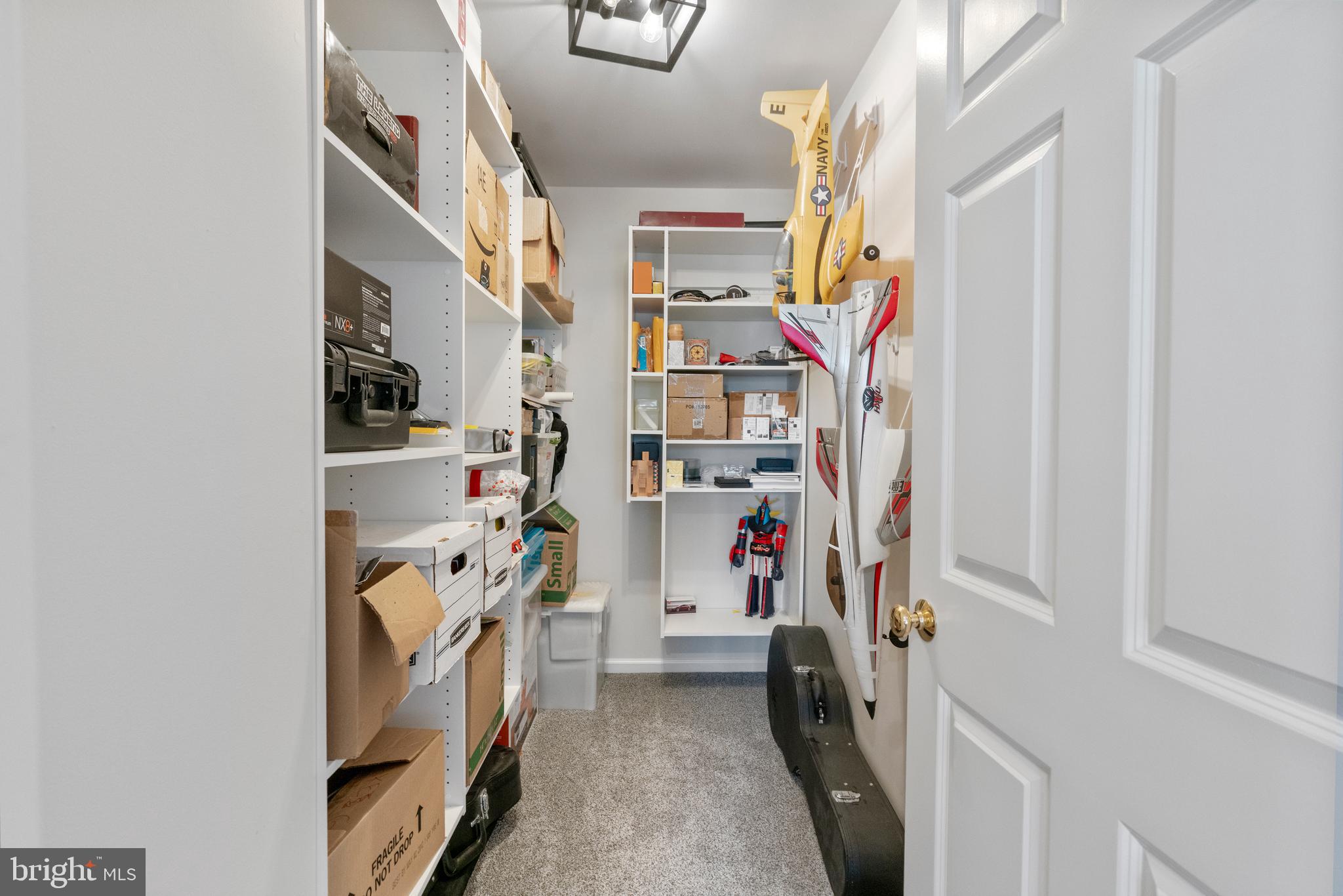 285 Cherry Lane Kennett Square, PA 19348 - Photo 35 of 38 a view of walk in closet with clothes and shoes
