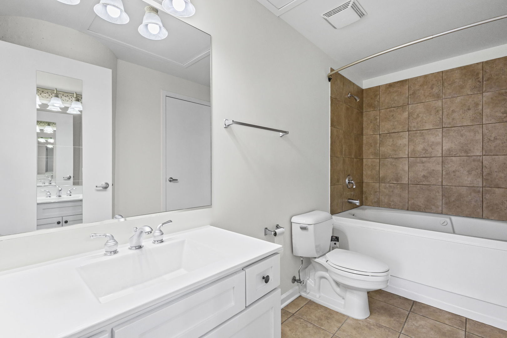 1530 South State Street, Unit 431 Chicago, IL 60605 - Photo 9 of 15 a bathroom with a toilet a sink a mirror a bathtub and shower