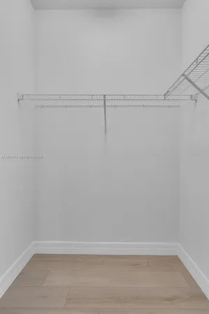 a view of a room with racks on the wall