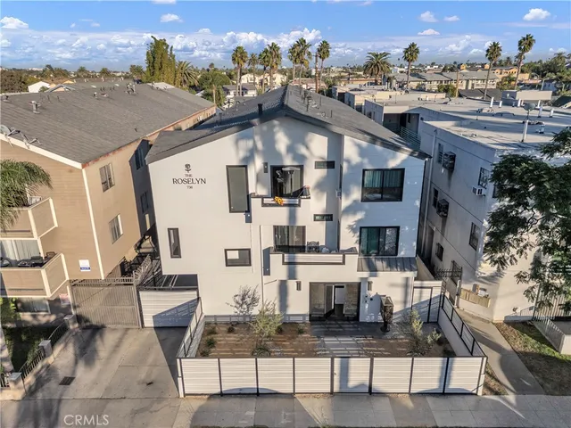 a aerial view of a house with table and chairs