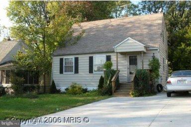 2405 Randolph Road Silver Spring, MD 20902 - Photo 1 of 1 a front view of a house with a garden