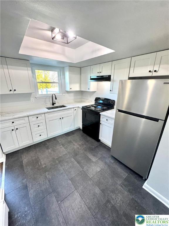 2041 Grove Street Allentown, PA 18104 - Photo 7 of 18 a kitchen with granite countertop stainless steel appliances a refrigerator a sink a stove a dining table and chairs