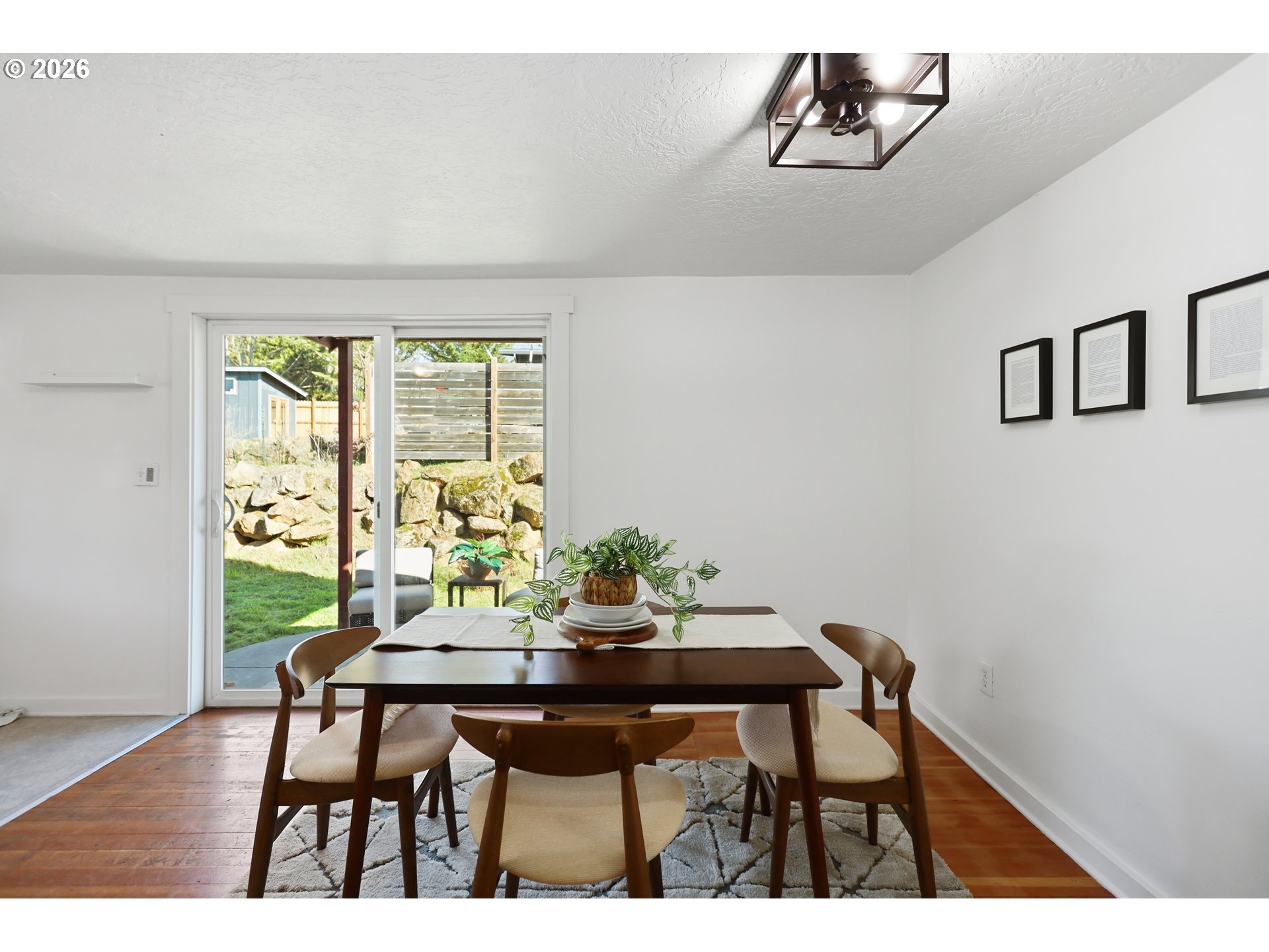 180 Northwest Spring Street White Salmon, WA 98672 - Photo 18 of 44 a view of a dining room with furniture window and wooden floor