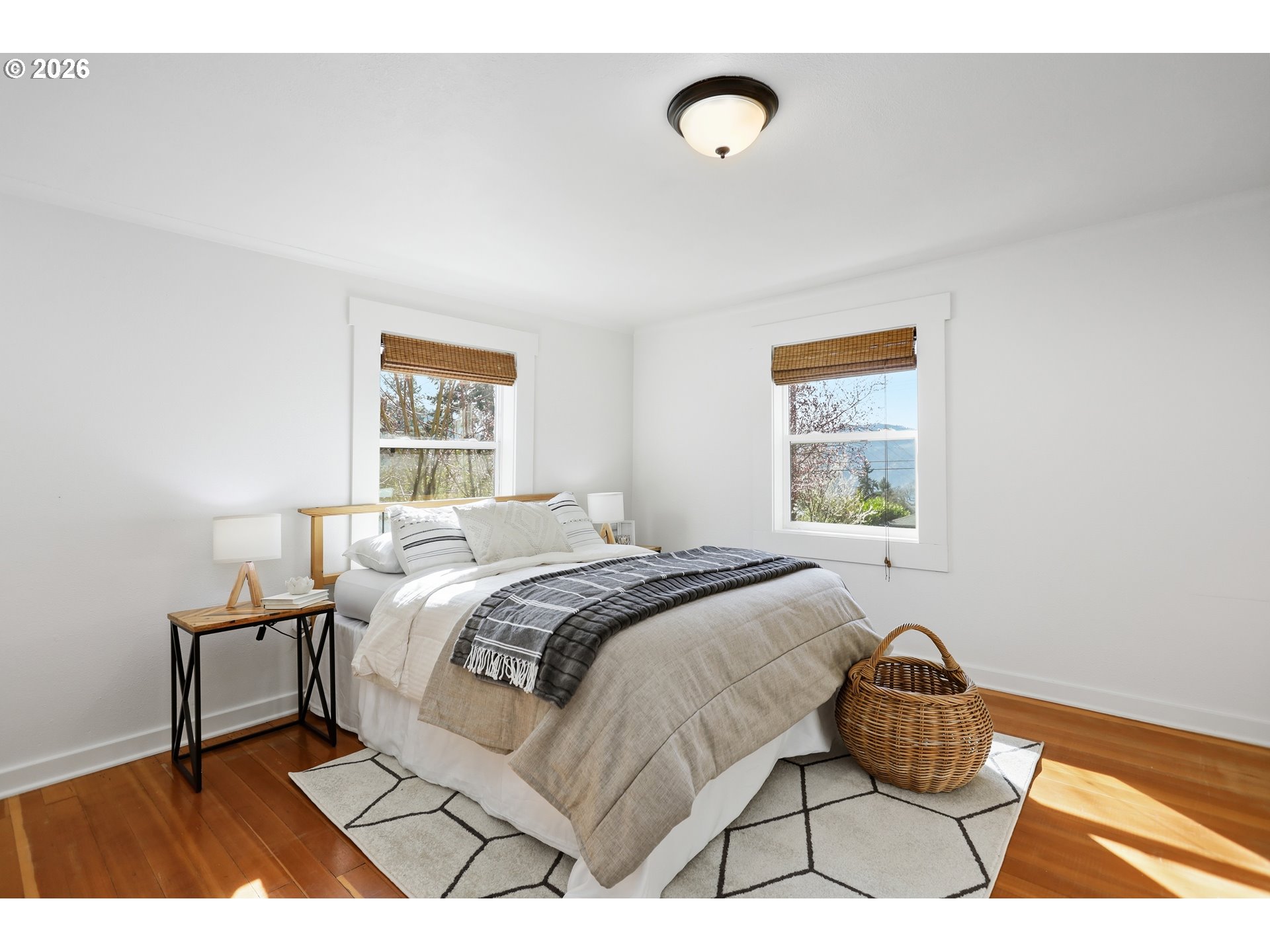 180 Northwest Spring Street White Salmon, WA 98672 - Photo 20 of 44 a bedroom with a bed and a window