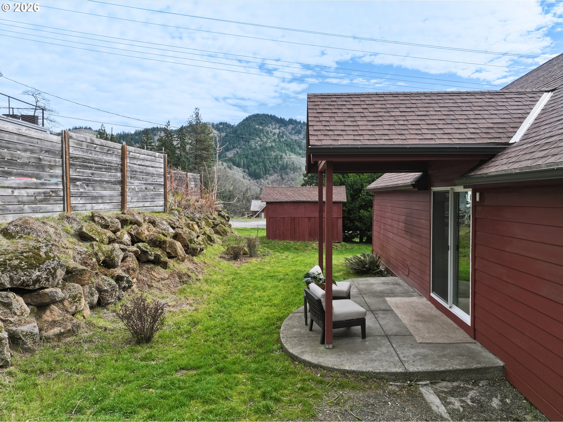 180 Northwest Spring Street White Salmon, WA 98672 - Photo 36 of 44 a view of a porch with furniture and garden