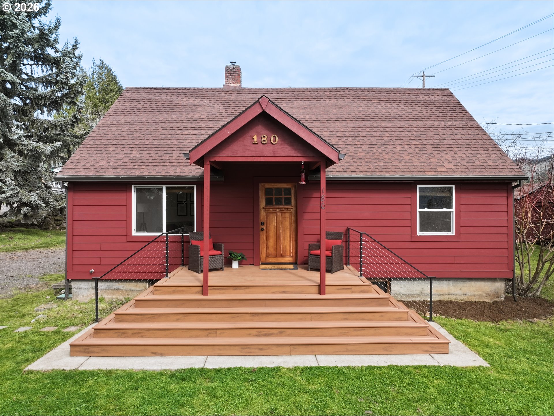 180 Northwest Spring Street White Salmon, WA 98672 - Photo 4 of 44 a front view of a house with a yard