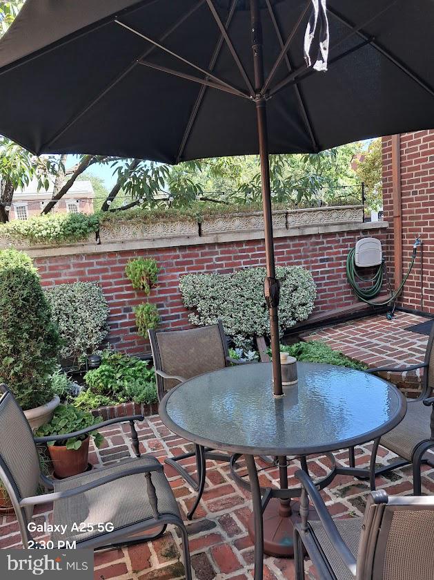 430 South 5th Street Philadelphia, PA 19147 - Photo 12 of 32 a view of a patio with table and chairs under an umbrella