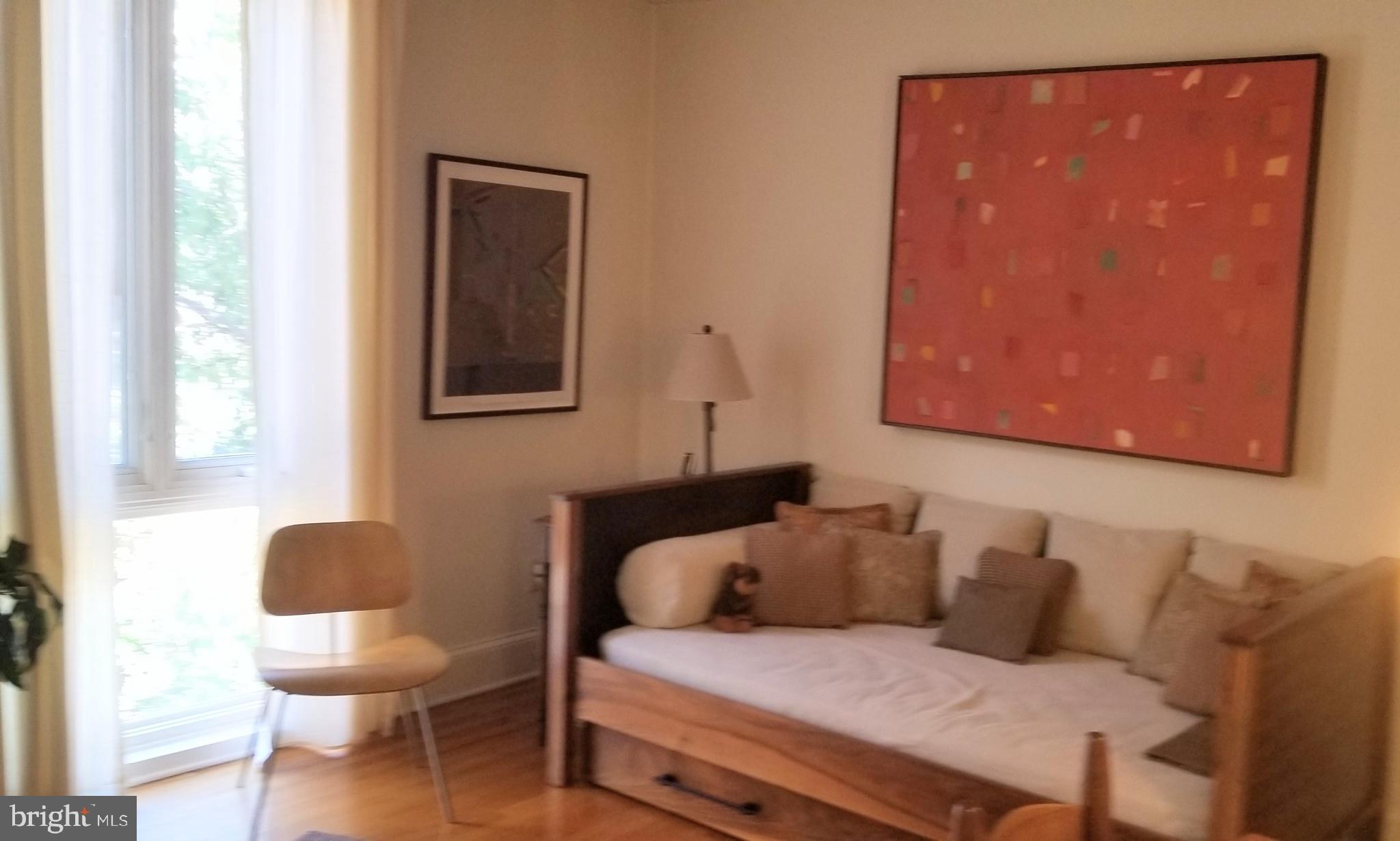 430 South 5th Street Philadelphia, PA 19147 - Photo 21 of 32 a bedroom with a bed and a chair