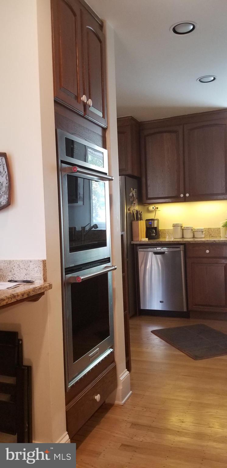 430 South 5th Street Philadelphia, PA 19147 - Photo 24 of 32 a kitchen with granite countertop a refrigerator and a stove