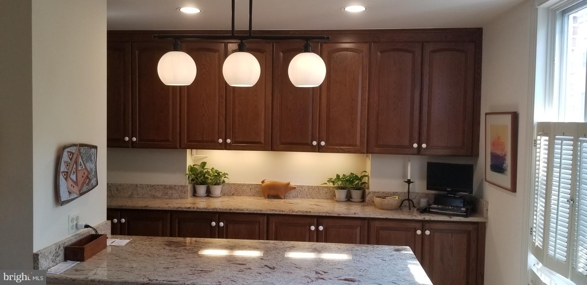 430 South 5th Street Philadelphia, PA 19147 - Photo 26 of 32 a kitchen with granite countertop a stove a cabinets and a sink