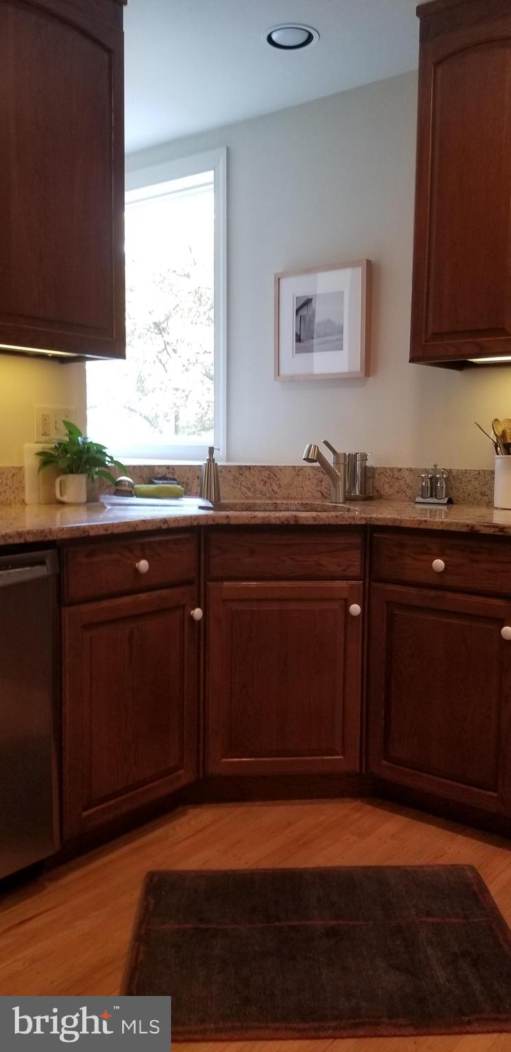 430 South 5th Street Philadelphia, PA 19147 - Photo 27 of 32 a kitchen with granite countertop a sink cabinets and a window