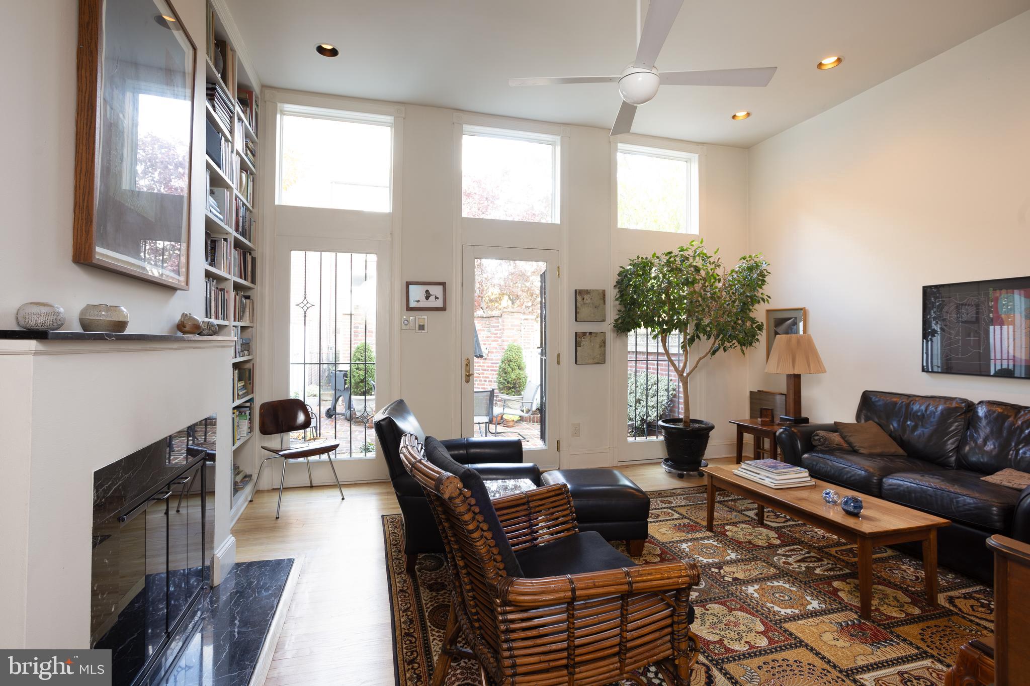 430 South 5th Street Philadelphia, PA 19147 - Photo 31 of 32 a living room with fireplace furniture and a large window