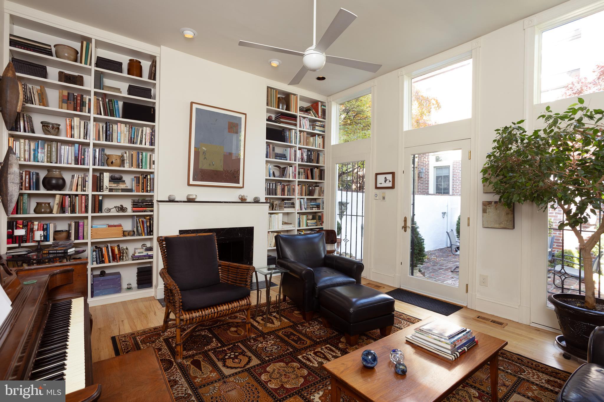 430 South 5th Street Philadelphia, PA 19147 - Photo 32 of 32 a living room with furniture a bookshelf and a window