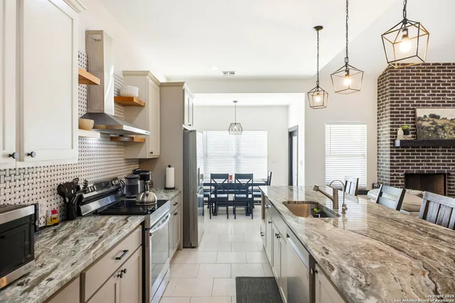 a living room with furniture a flat screen tv and a large window
