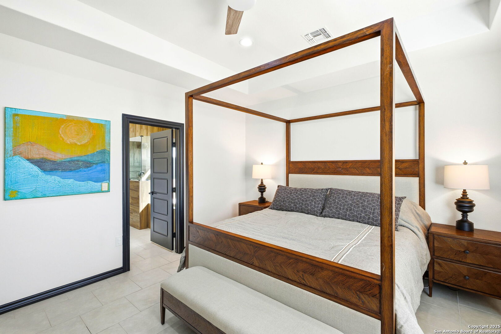 418 Tawny Oak Circle Bandera, TX 78003 - Photo 15 of 33 a bedroom with a bed and glass windows