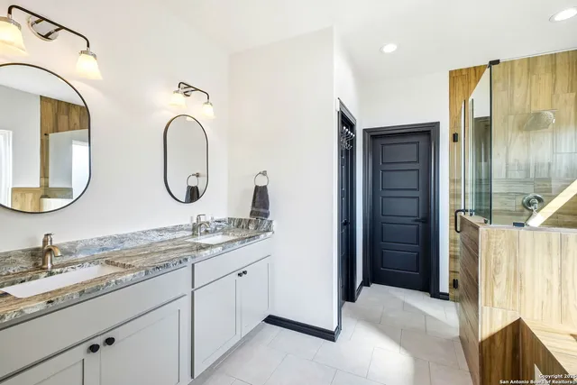 a bathroom with a bathtub and a shower