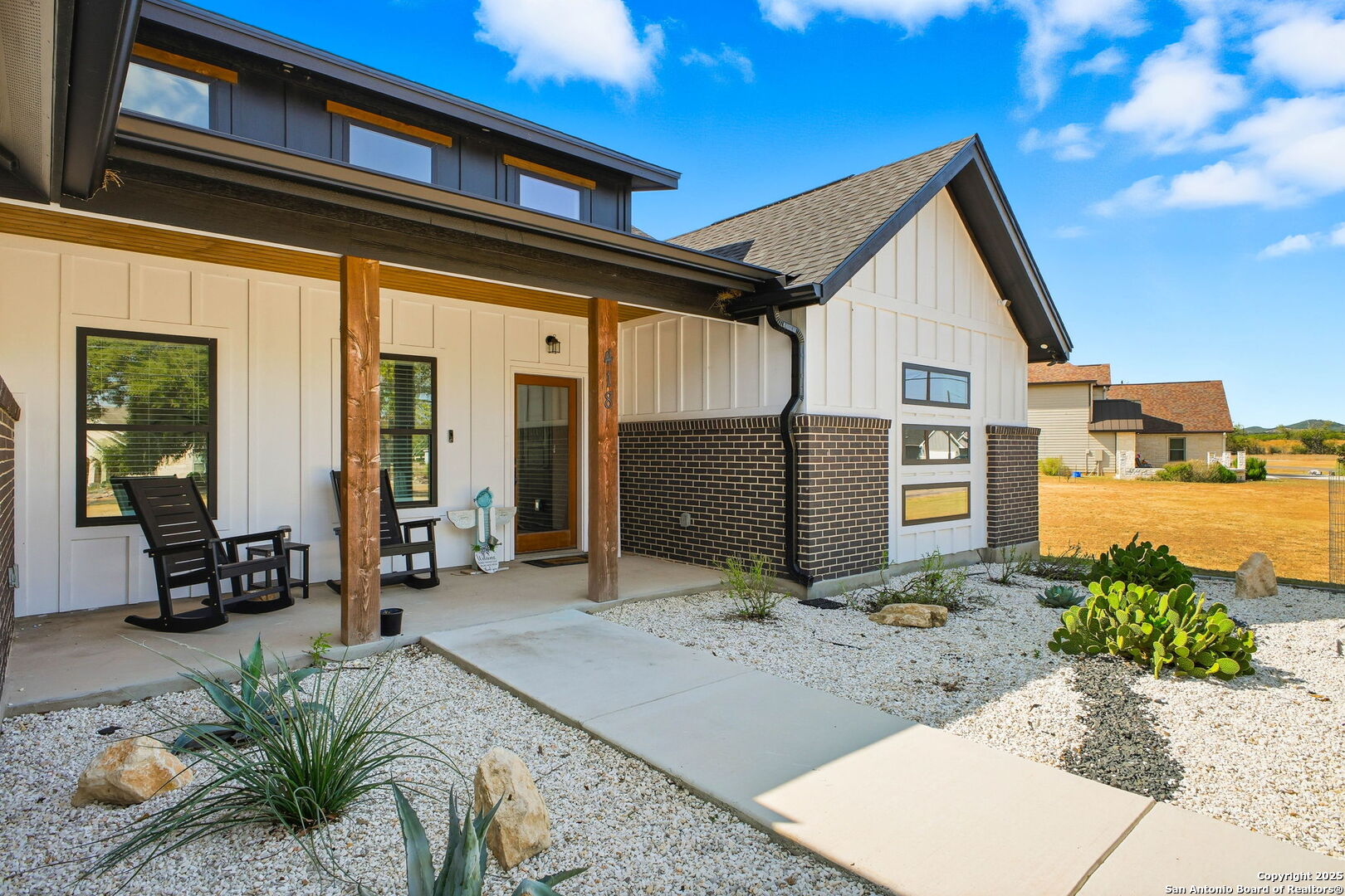 418 Tawny Oak Circle Bandera, TX 78003 - Photo 2 of 33 a front view of a house with a yard