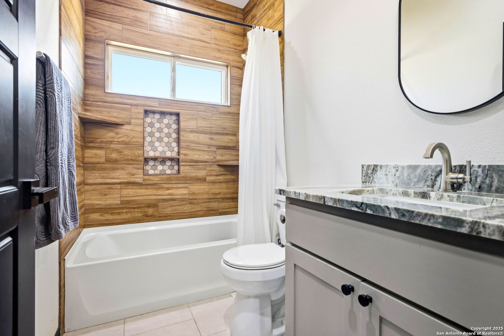418 Tawny Oak Circle Bandera, TX 78003 - Photo 22 of 33 a bathroom with a granite countertop sink toilet and shower