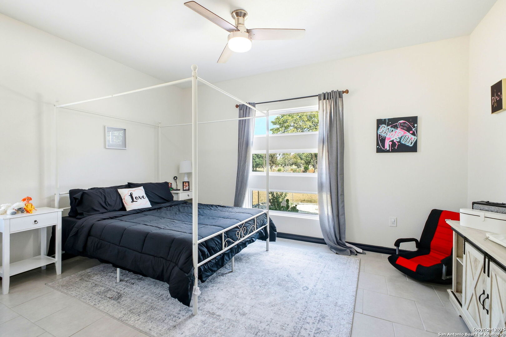 418 Tawny Oak Circle Bandera, TX 78003 - Photo 23 of 33 a bedroom with a bed and a window