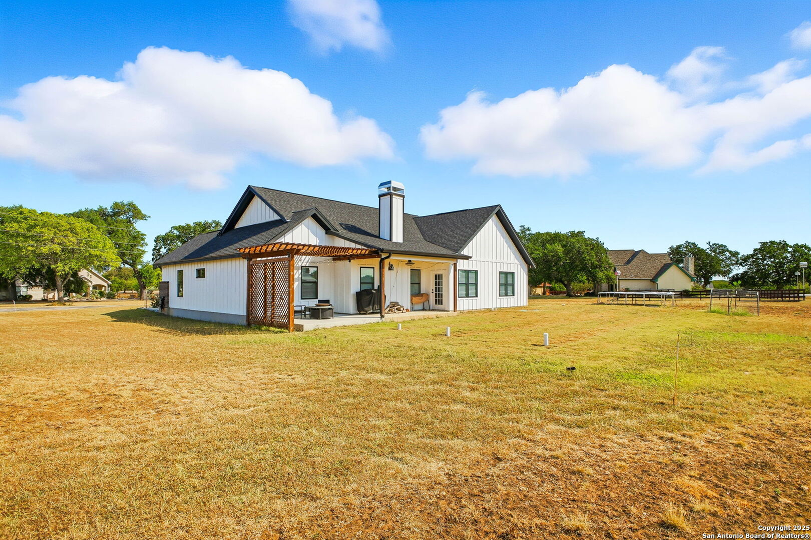 418 Tawny Oak Circle Bandera, TX 78003 - Photo 27 of 33 a front view of a house with a yard