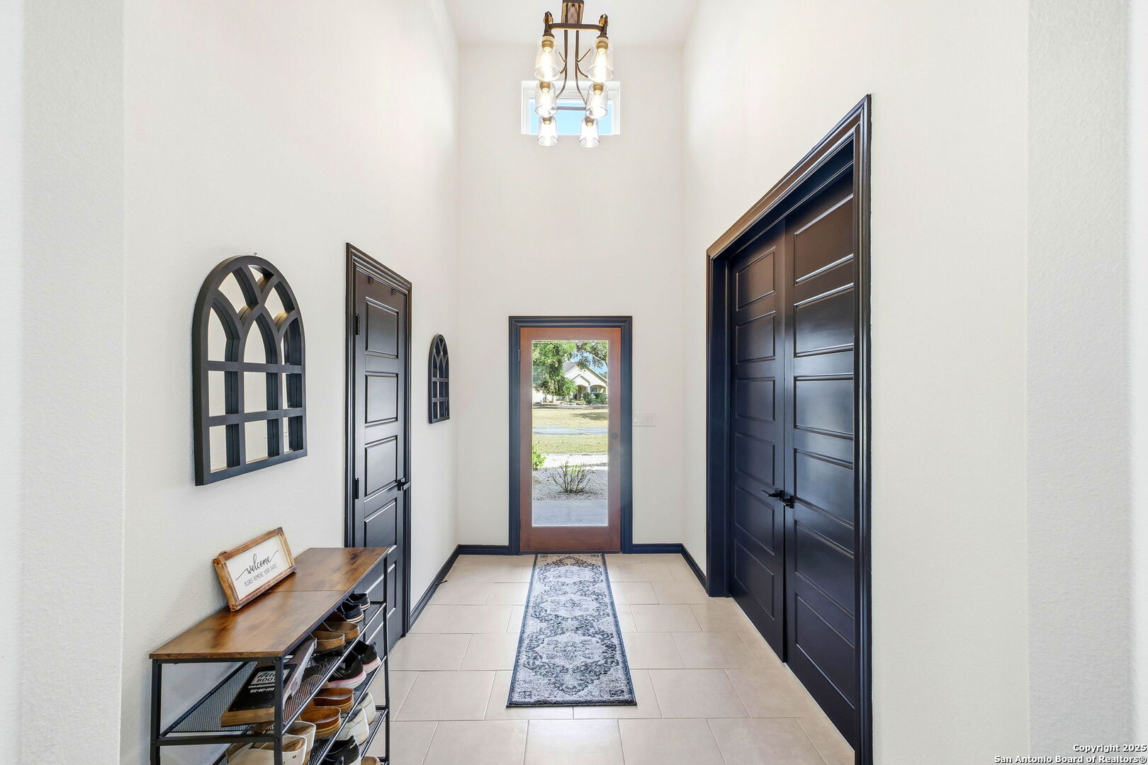 418 Tawny Oak Circle Bandera, TX 78003 - Photo 3 of 33 a view of a hallway with windows