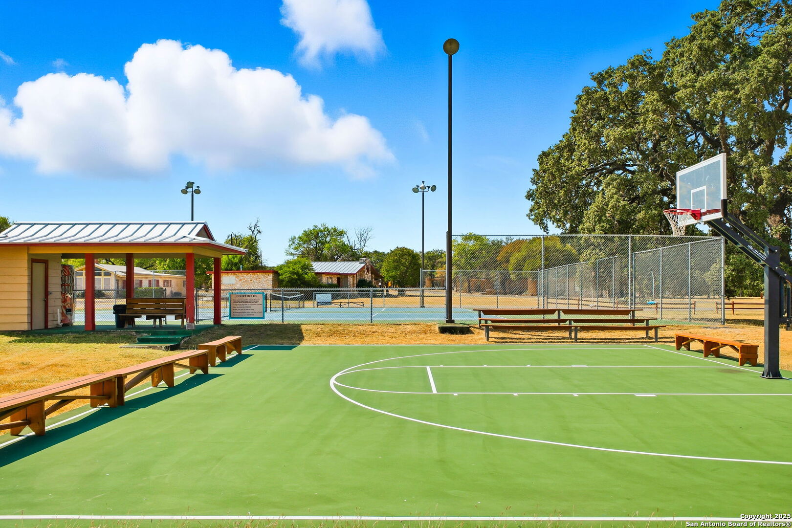 418 Tawny Oak Circle Bandera, TX 78003 - Photo 32 of 33 a view of a swimming pool with a yard and from a large tree