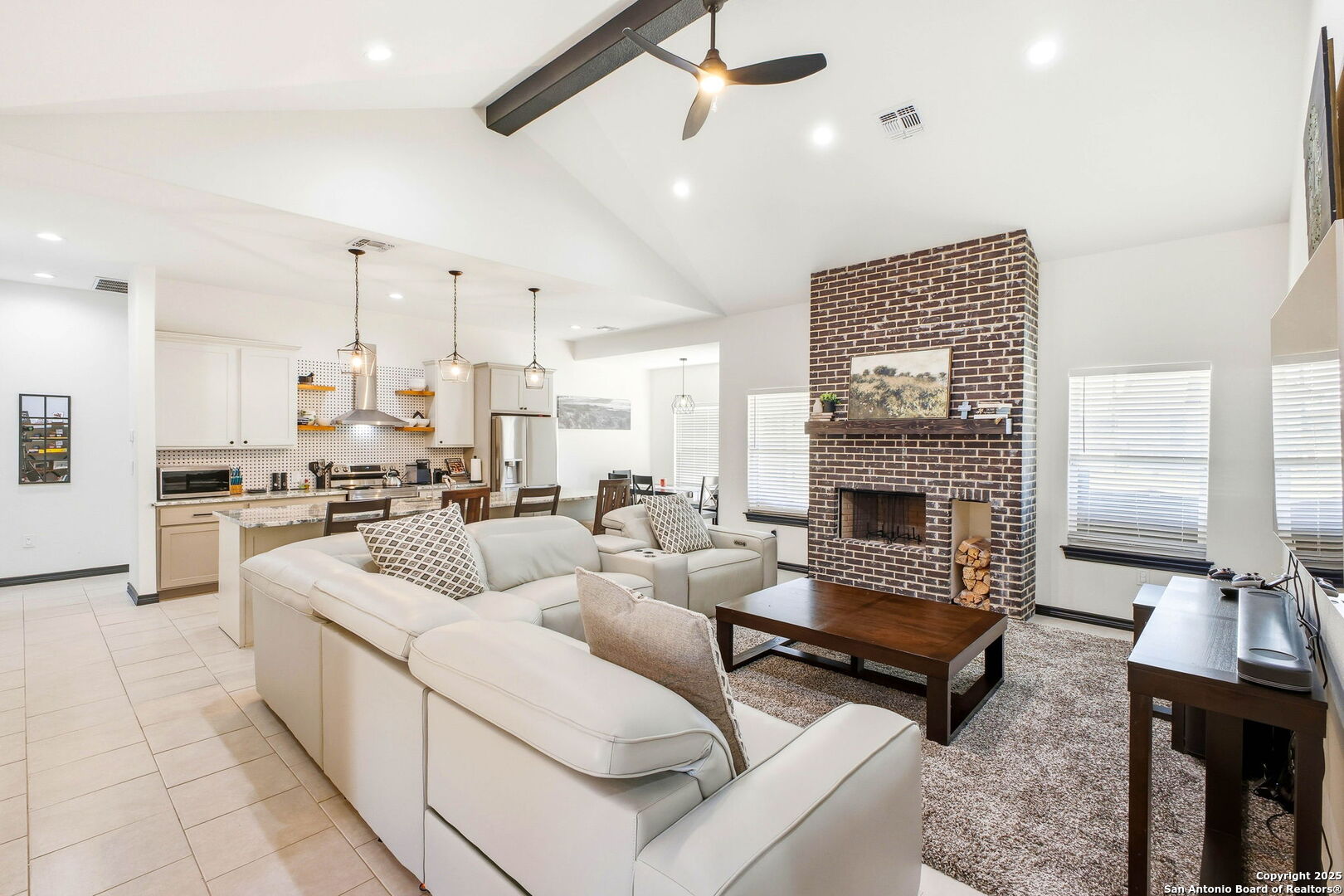 418 Tawny Oak Circle Bandera, TX 78003 - Photo 6 of 33 a living room with furniture and a fireplace