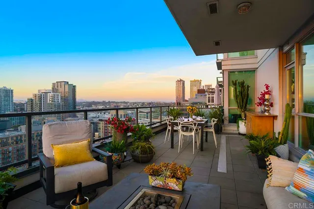 a view of a terrace with chairs and potted plants
