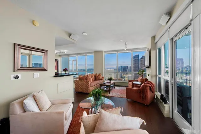 a living room with furniture or couch and a large window