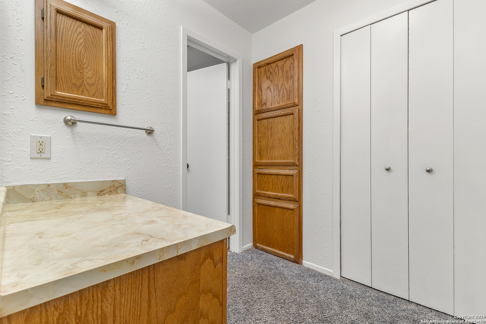 11520 Huebner Road, Unit 201 San Antonio, TX 78230 - Photo 16 of 19 a bathroom with a granite countertop sink and a mirror