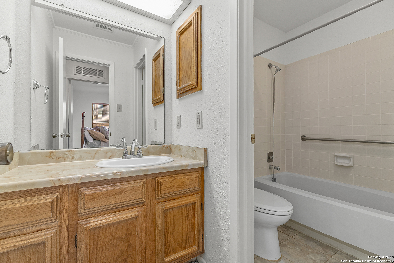 11520 Huebner Road, Unit 201 San Antonio, TX 78230 - Photo 17 of 19 a bathroom with a granite countertop sink toilet and shower