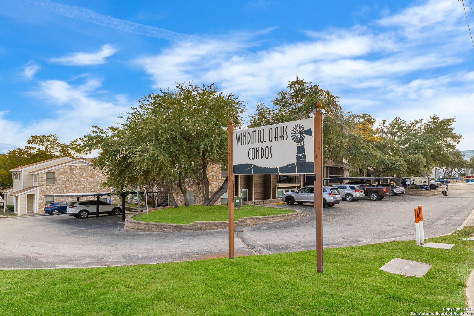 11520 Huebner Road, Unit 201 San Antonio, TX 78230 - Photo 2 of 19 a sign board with a play ground in the back