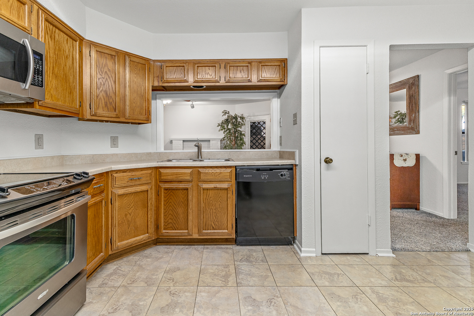11520 Huebner Road, Unit 201 San Antonio, TX 78230 - Photo 8 of 19 a kitchen with stainless steel appliances granite countertop a stove and a sink