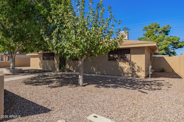 a view of a house with a yard and garage